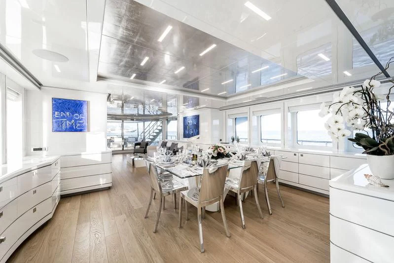 a kitchen with a dining table aboard ANGKALIA Yacht for Sale