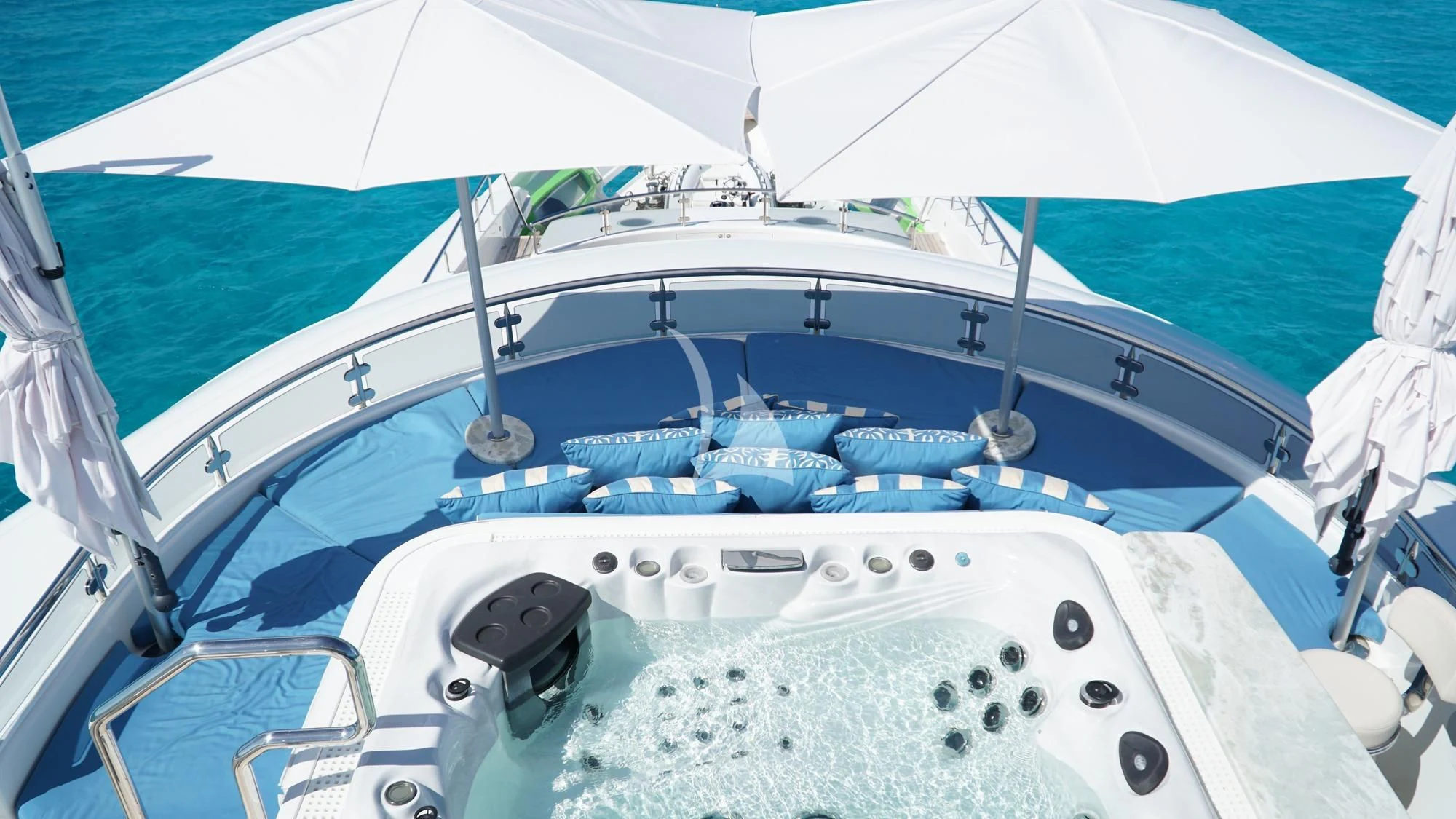 a boat with white umbrellas aboard TRENDING Yacht for Sale
