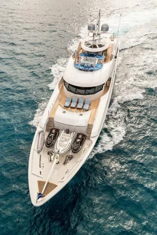a white boat on the water aboard TRENDING Yacht for Sale