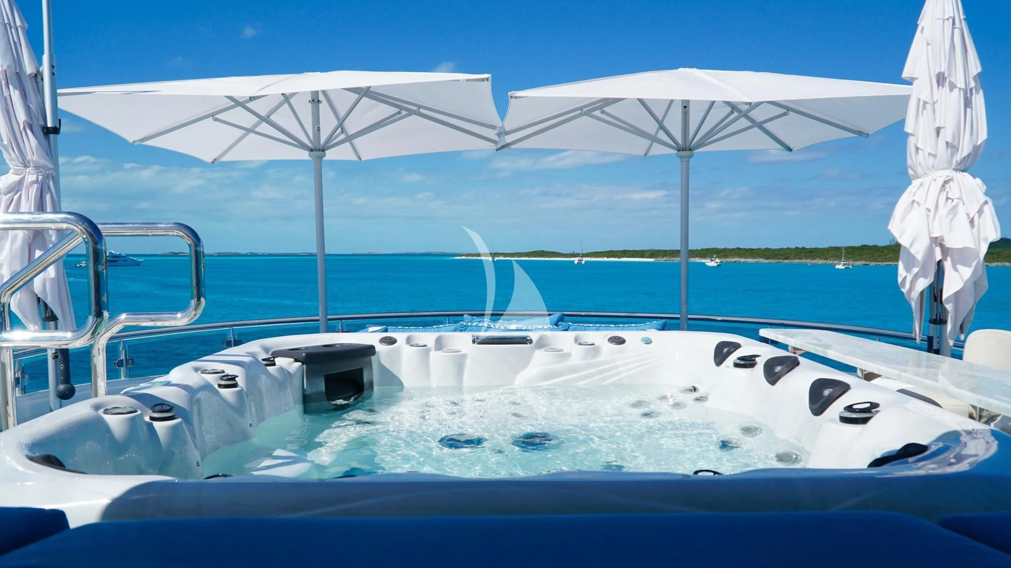 a boat with white umbrellas aboard TRENDING Yacht for Sale