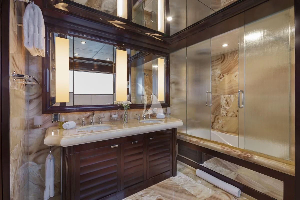 a bathroom with a large mirror aboard TRENDING Yacht for Sale