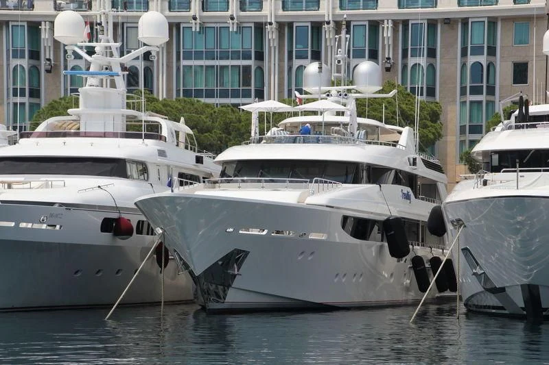 several boats docked in a harbor aboard TRENDING Yacht for Sale