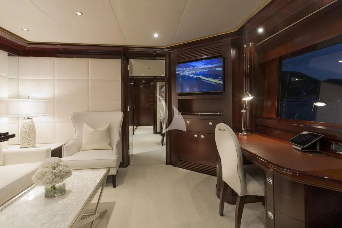 a living room with a tv and furniture aboard TRENDING Yacht for Sale