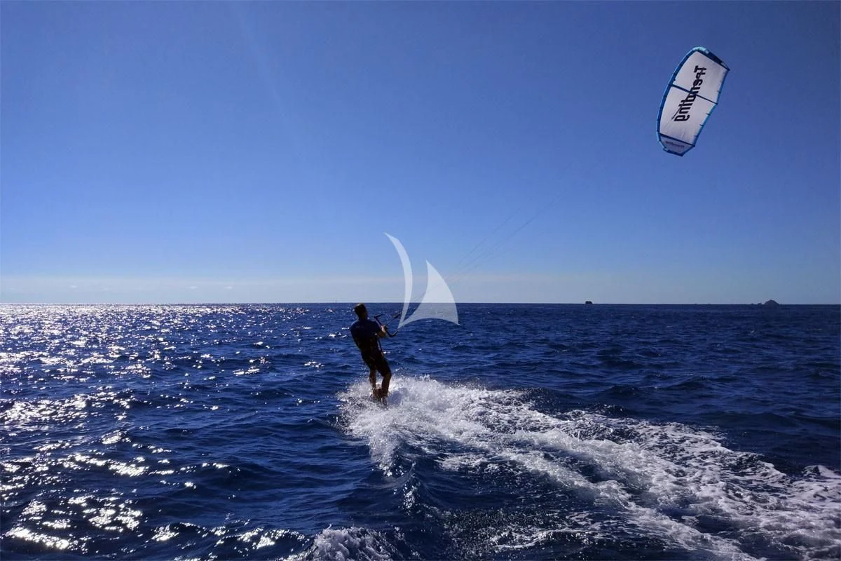 a person kite surfing on the sea aboard TRENDING Yacht for Sale