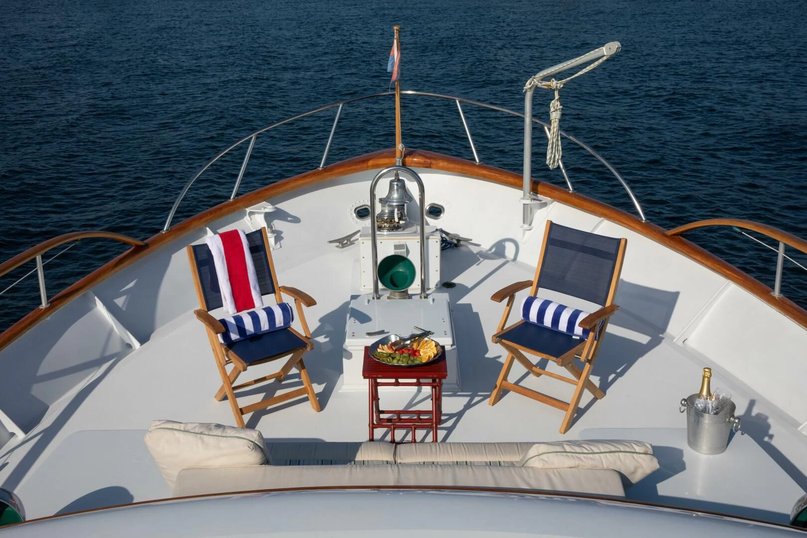a boat with a flag on the front aboard KOALA Yacht for Sale