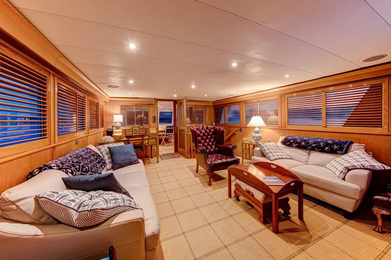 a bedroom with a bed and a couch aboard KOALA Yacht for Sale