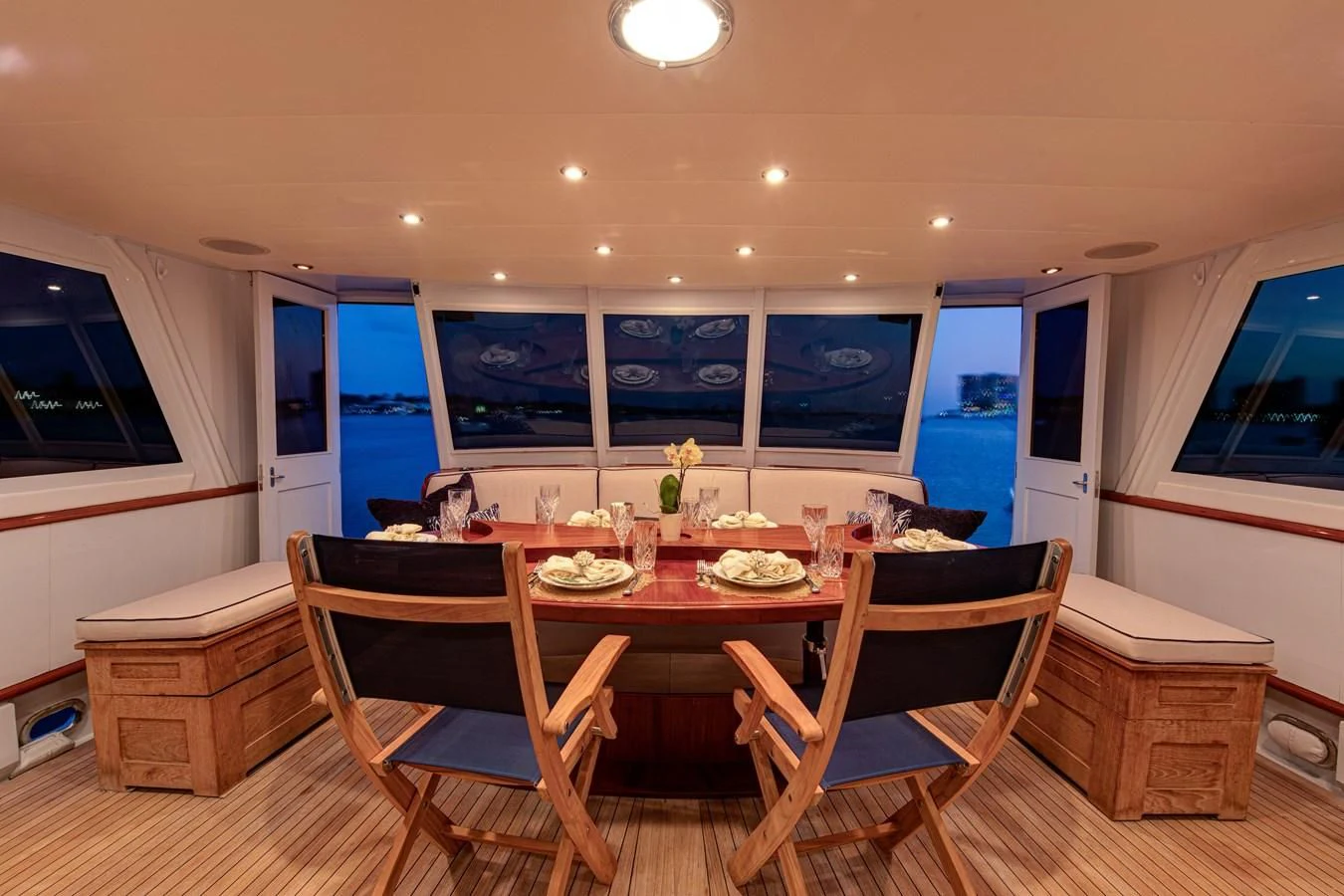 a dining room with a table and chairs aboard KOALA Yacht for Sale
