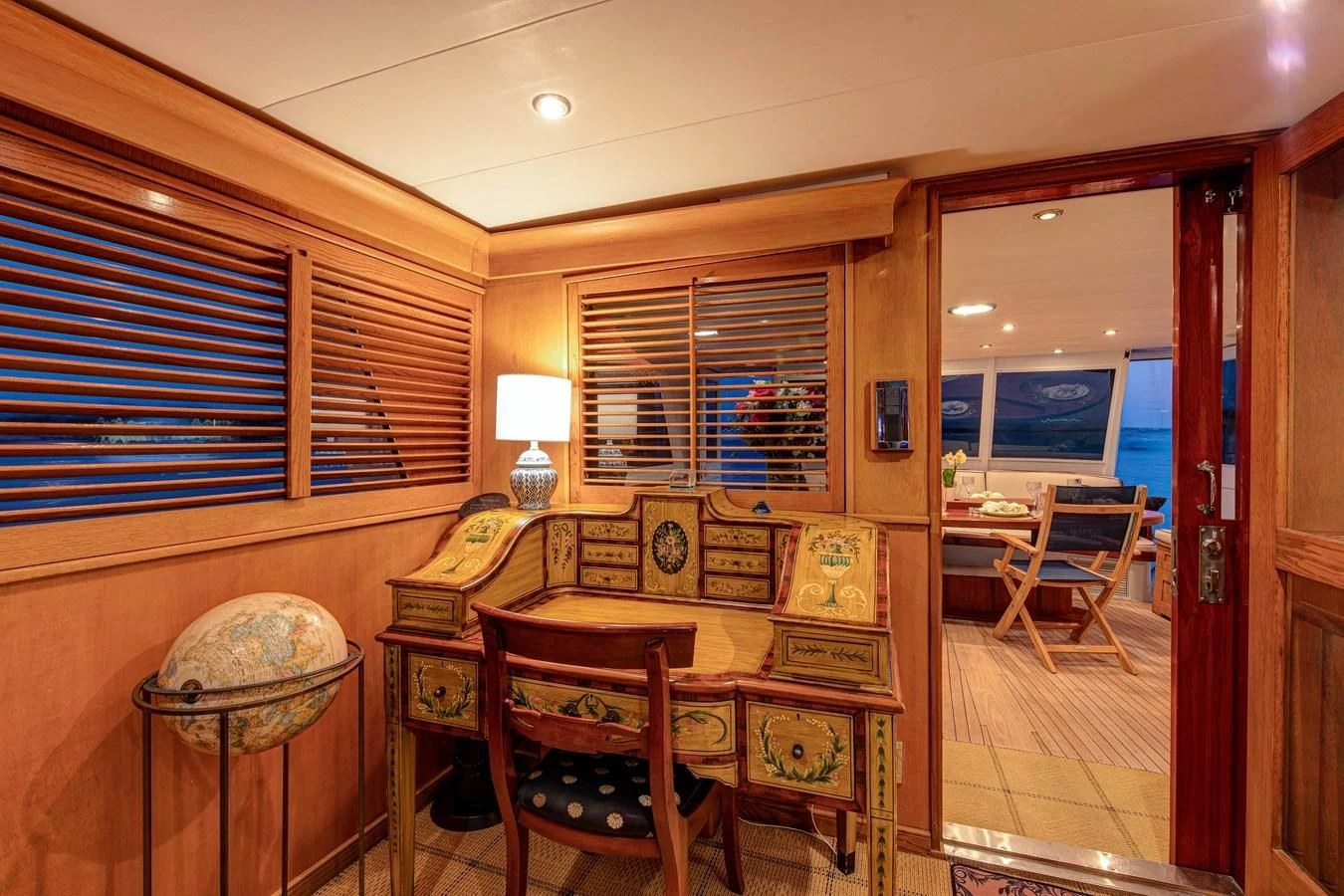 a room with a table and chairs aboard KOALA Yacht for Sale