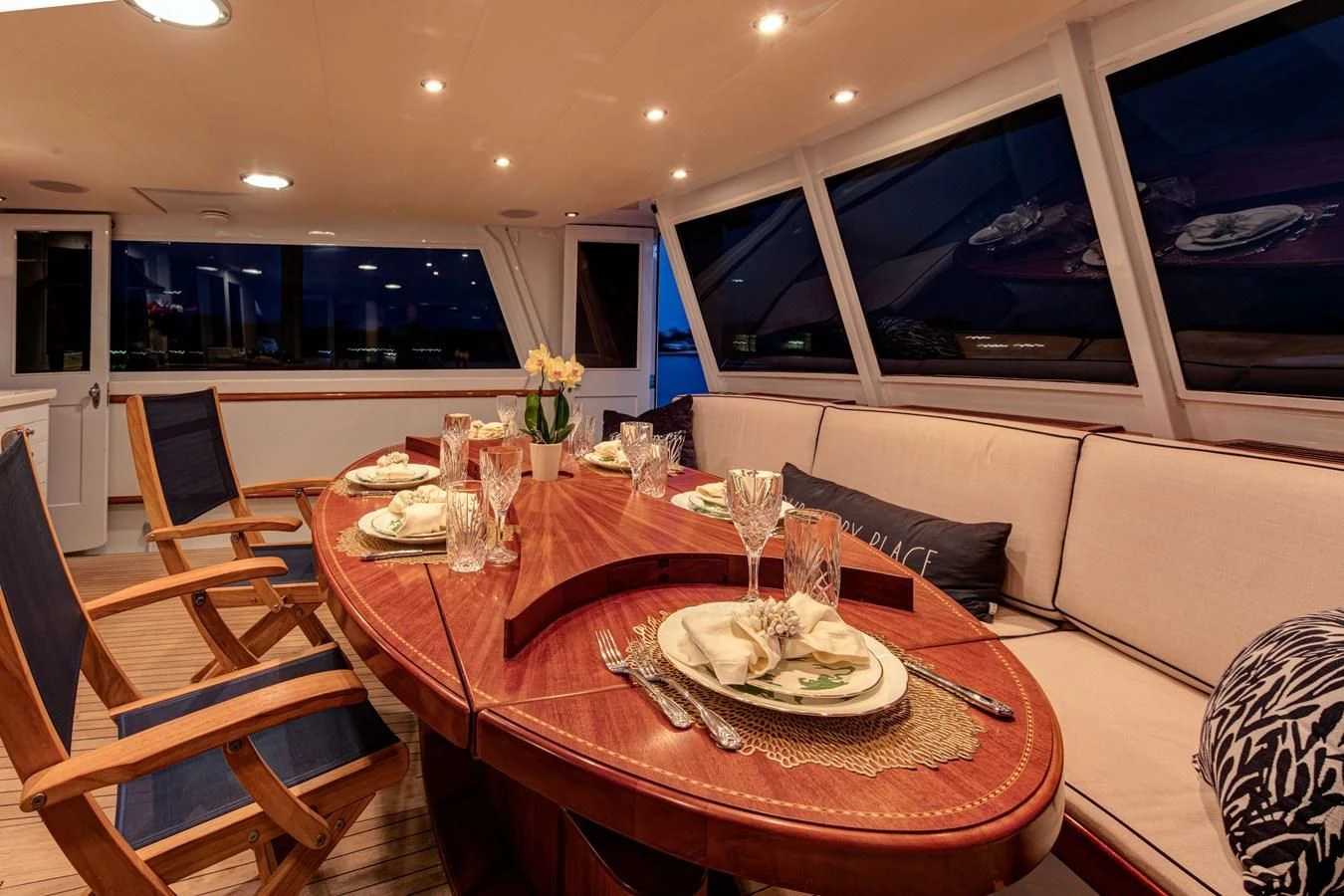 a dining table in a living room aboard KOALA Yacht for Sale