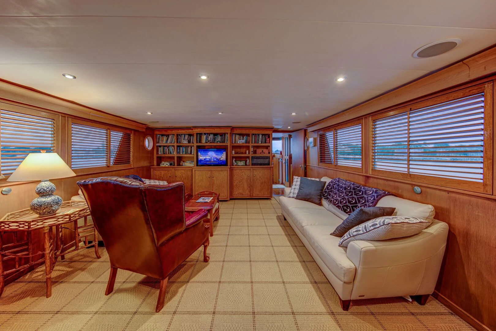 a living room with a couch and a table aboard KOALA Yacht for Sale