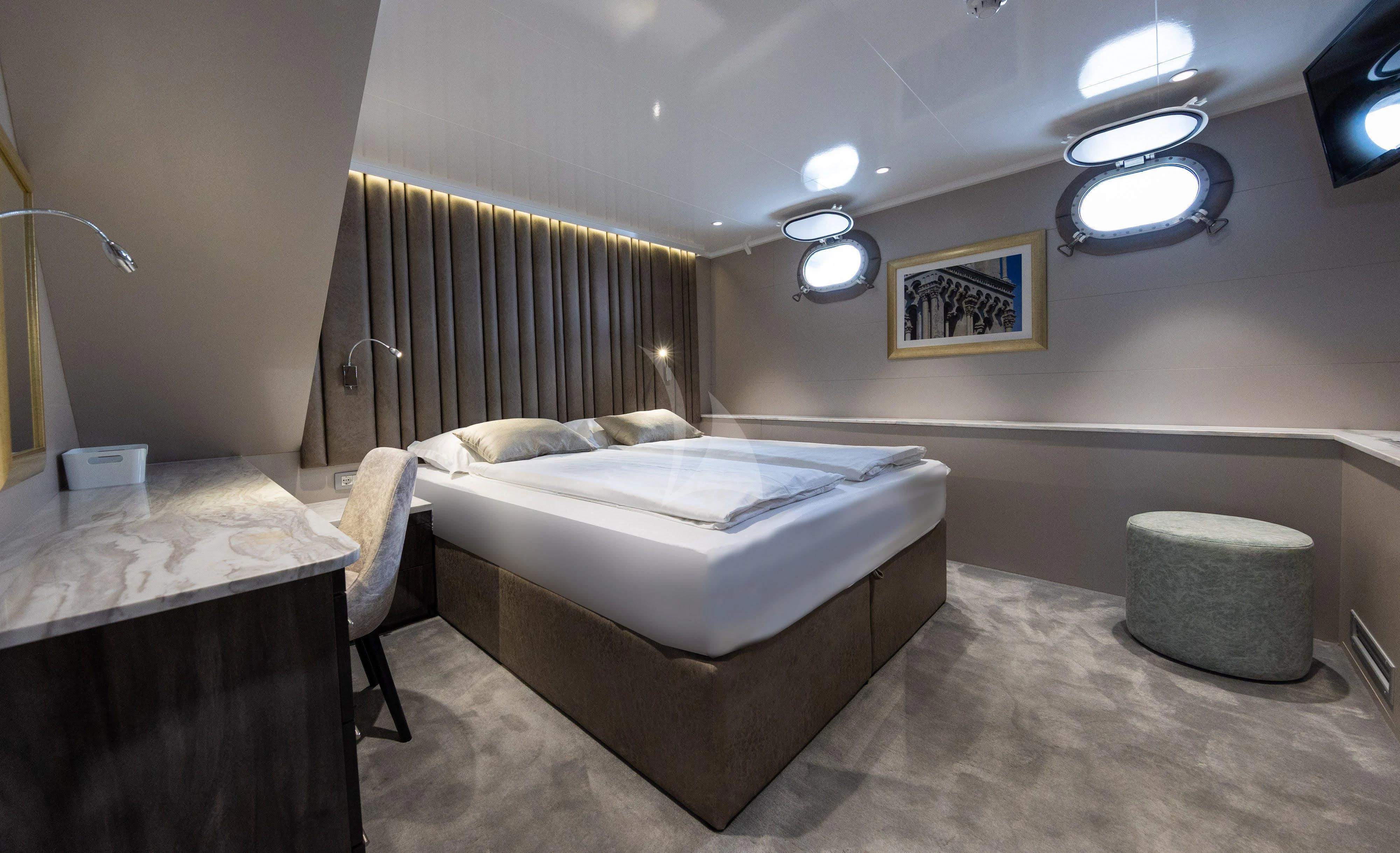 a room with two beds aboard LADY ELEGANZA Yacht for Sale