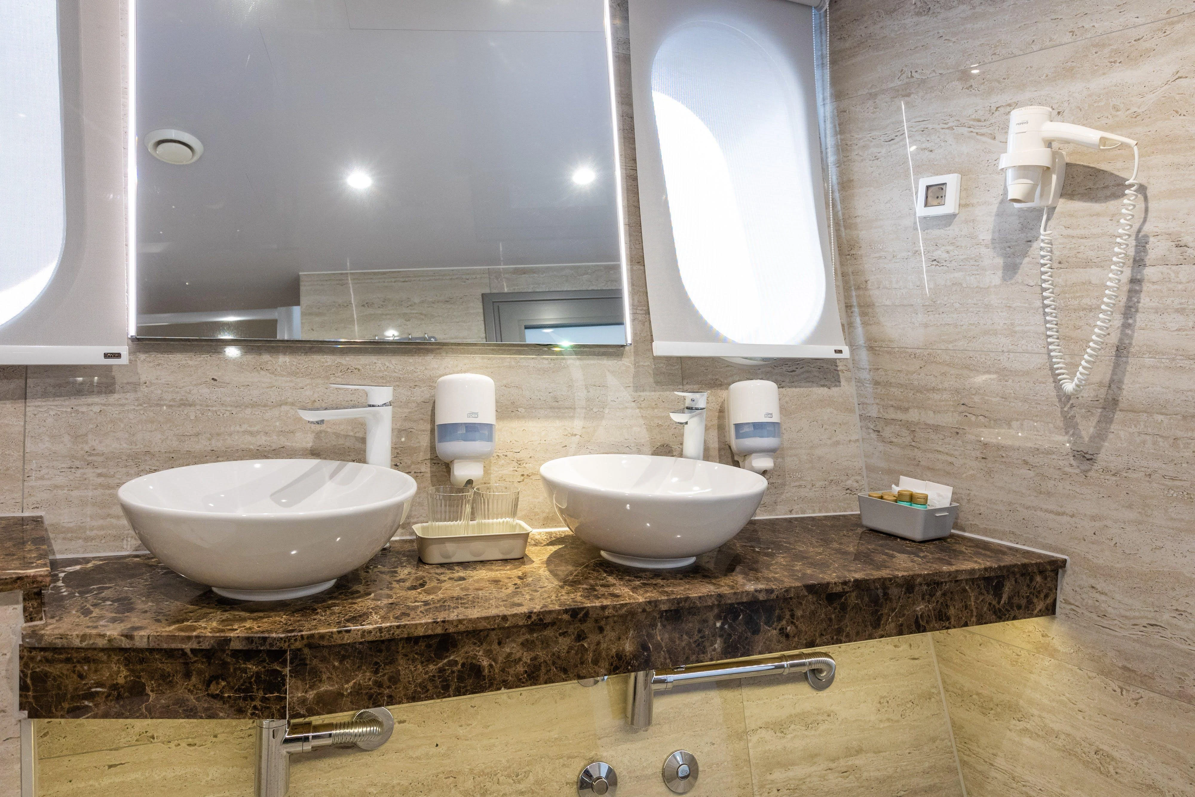 a bathroom with two sinks aboard LADY ELEGANZA Yacht for Sale