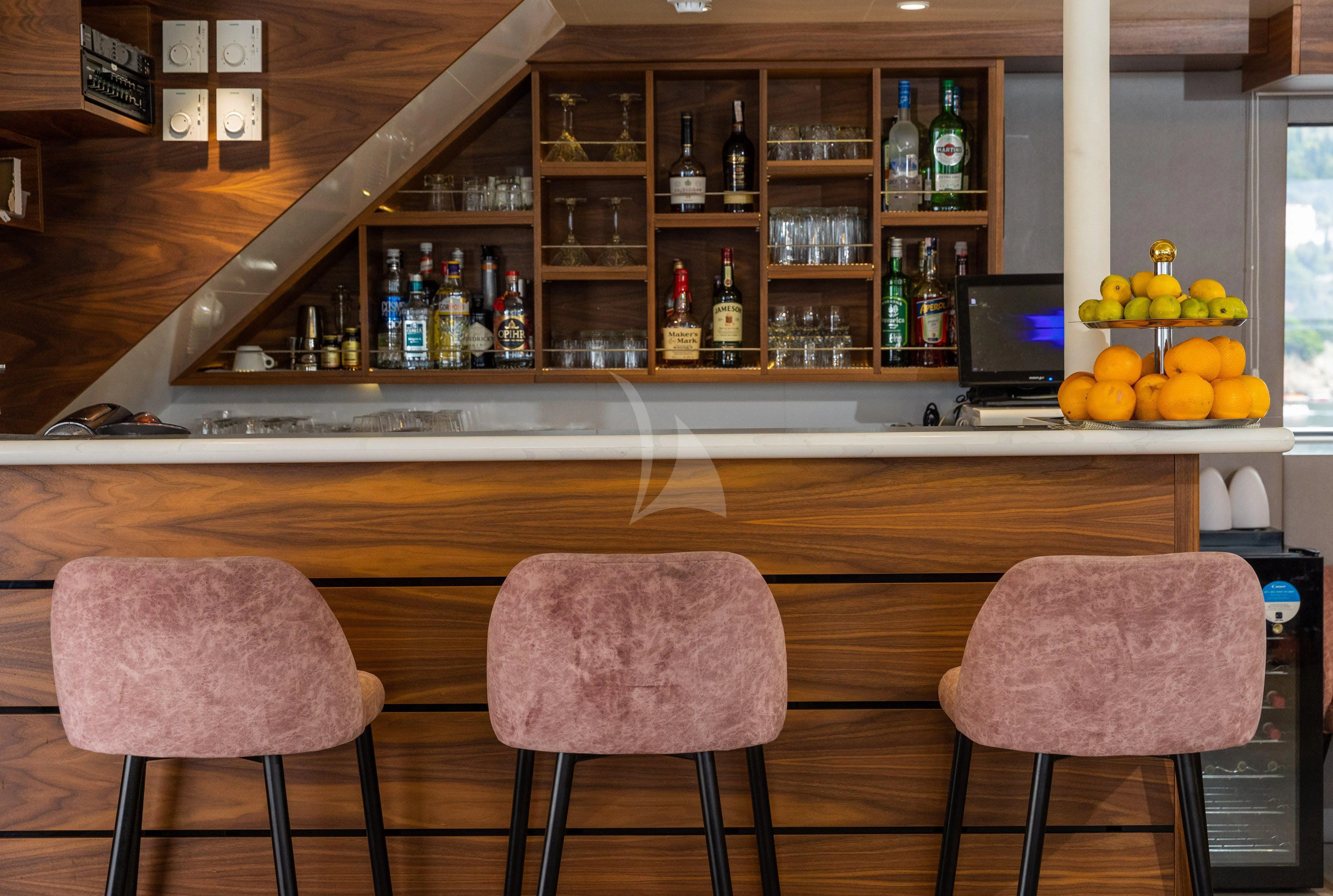 a couple of chairs sit near a counter aboard LADY ELEGANZA Yacht for Sale