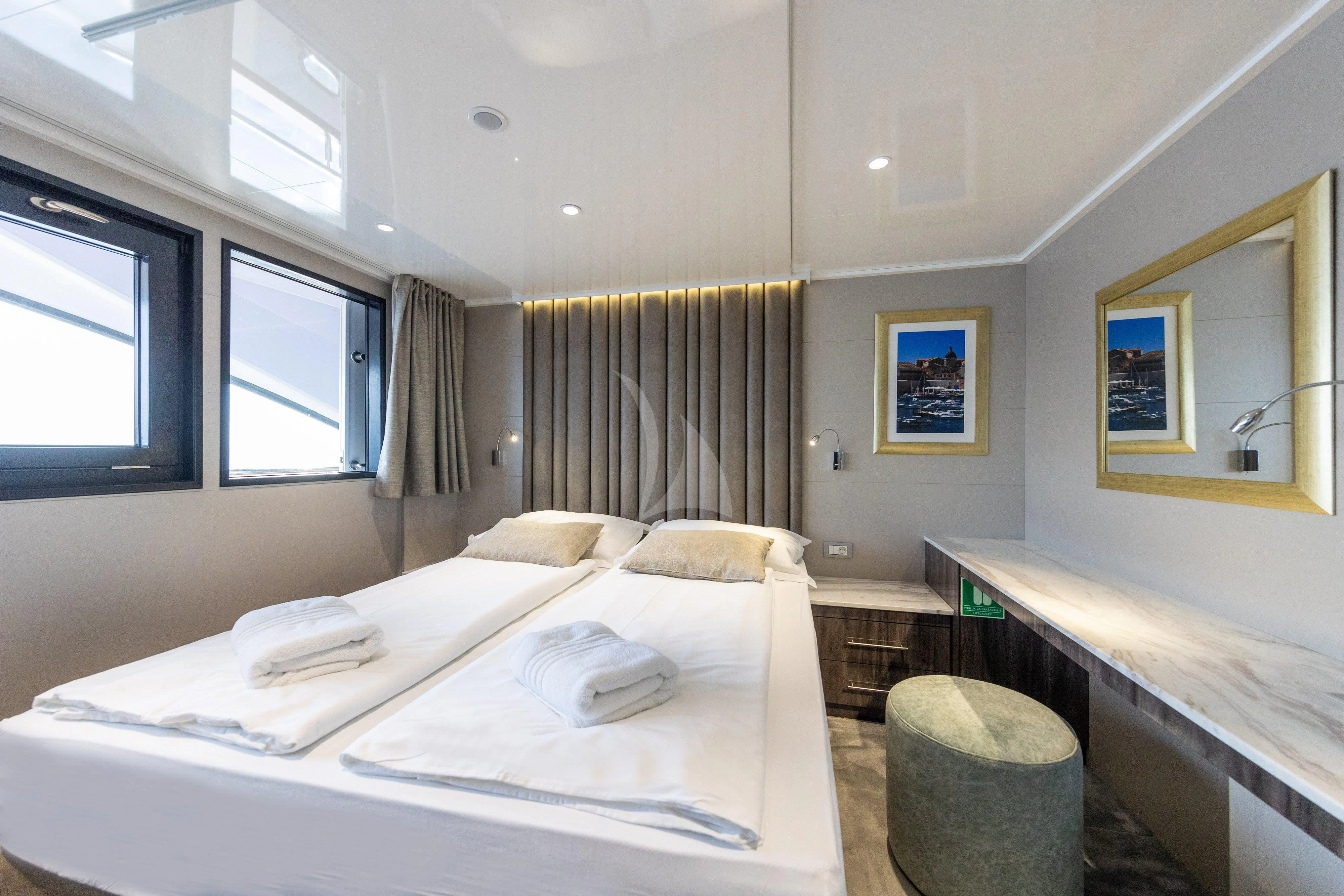 a room with two beds aboard LADY ELEGANZA Yacht for Sale