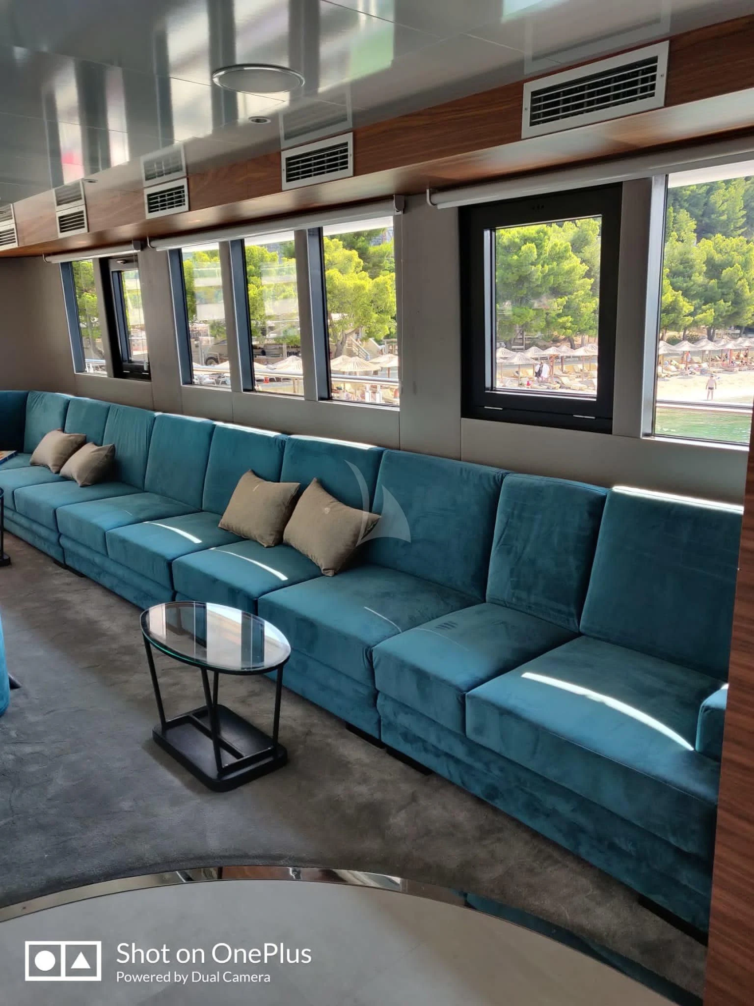 a blue couch in a train car aboard LADY ELEGANZA Yacht for Sale