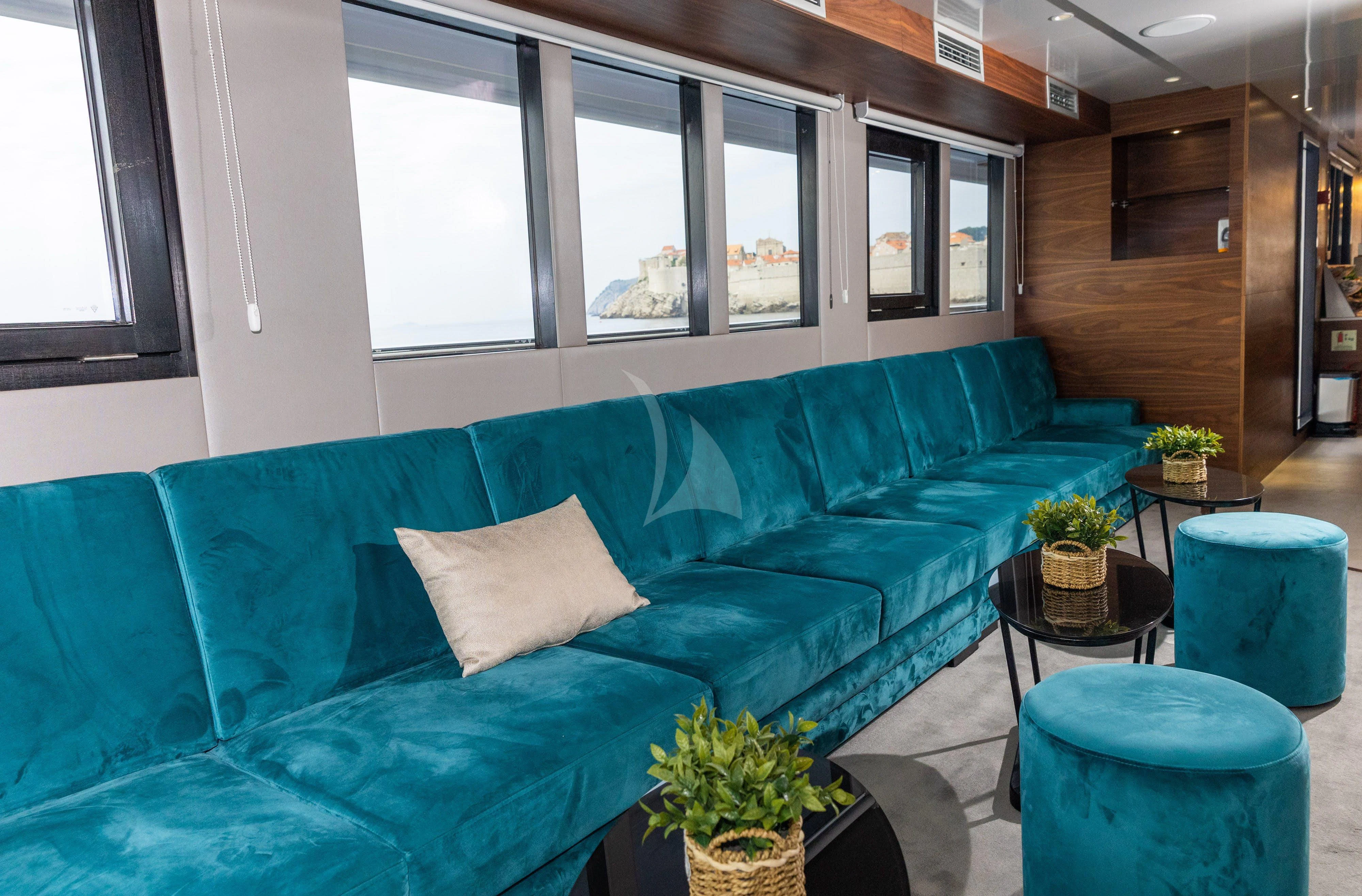 a couch in a room aboard LADY ELEGANZA Yacht for Sale