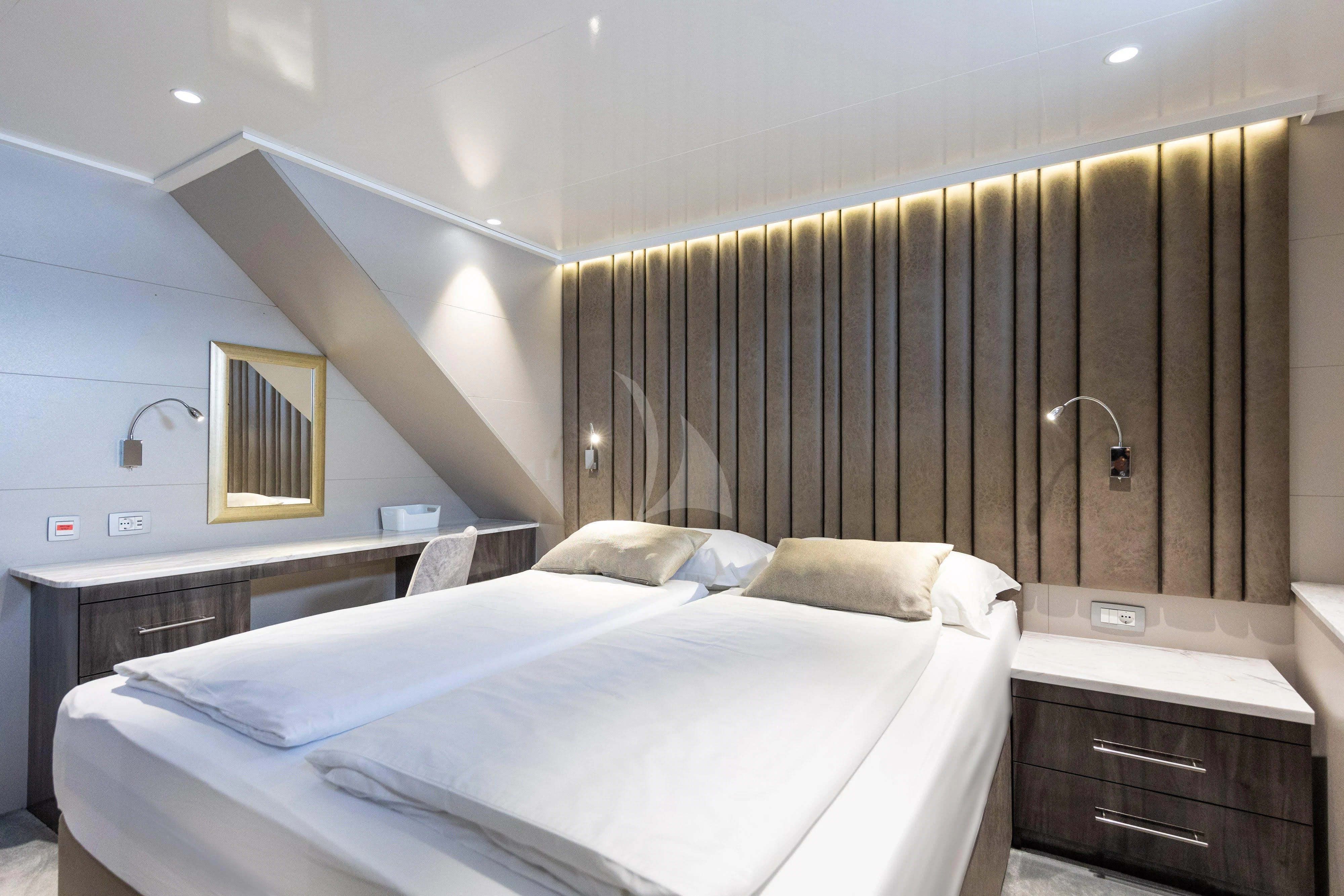 a room with two beds aboard LADY ELEGANZA Yacht for Sale