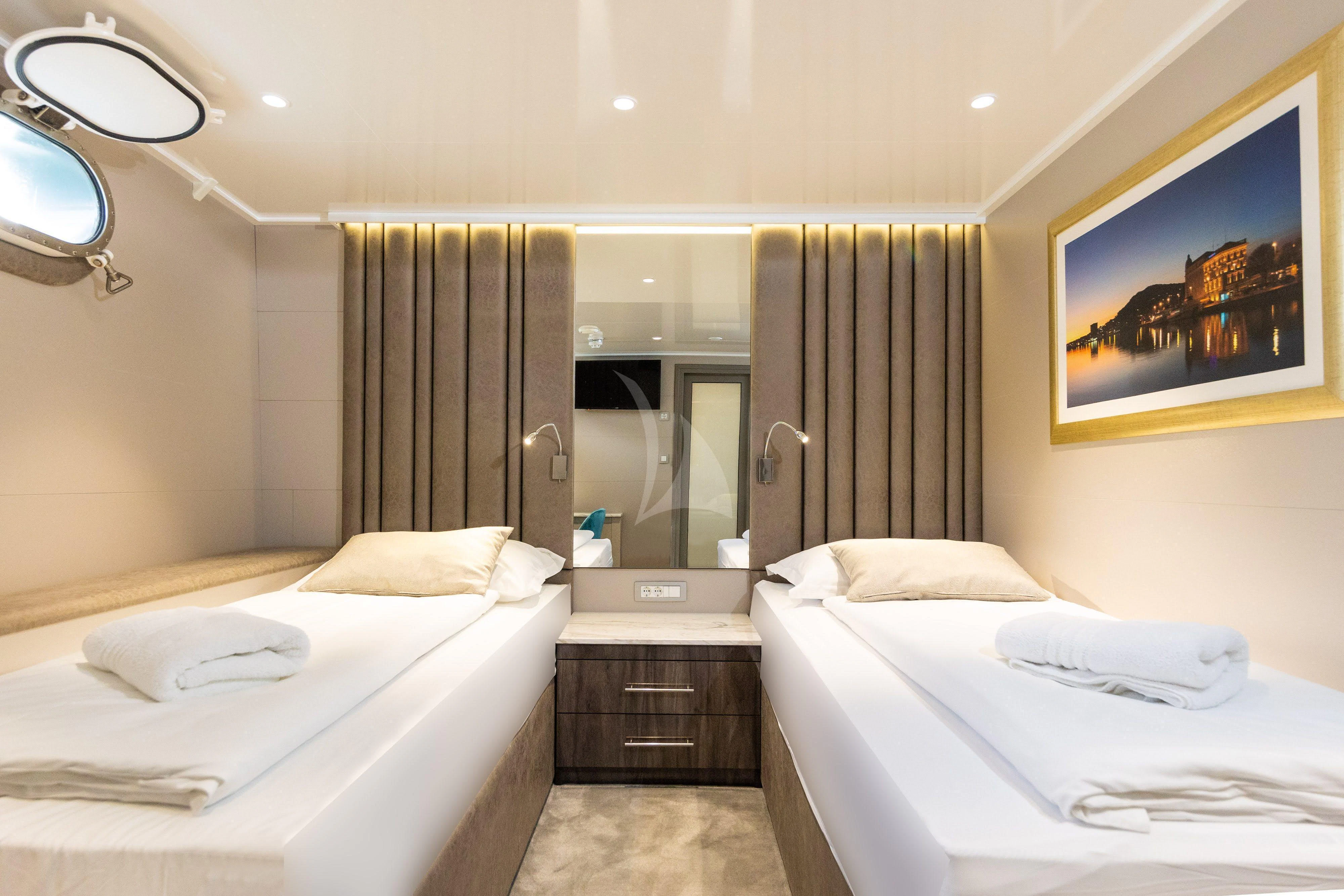 a room with two beds aboard LADY ELEGANZA Yacht for Sale