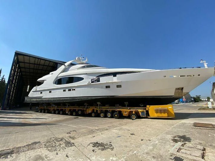 a white airplane on a trailer aboard PROJECT CAVALLI Yacht for Sale