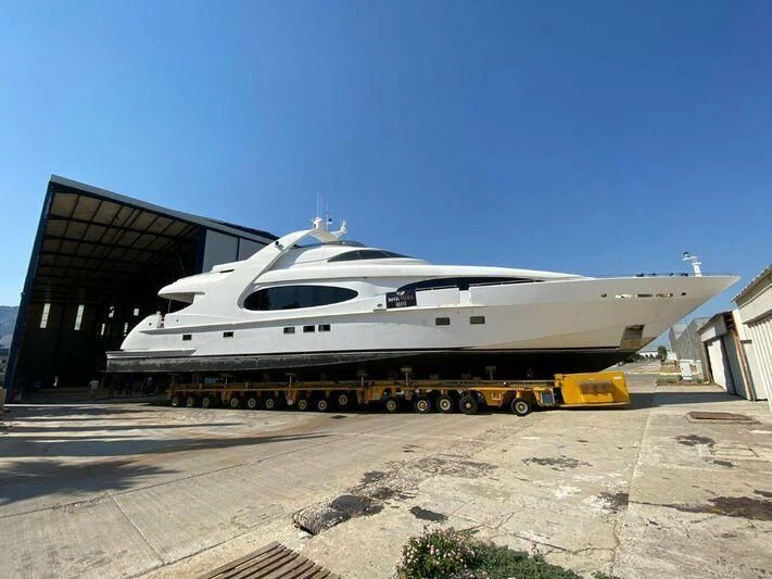 a white yacht on a trailer aboard PROJECT CAVALLI Yacht for Sale