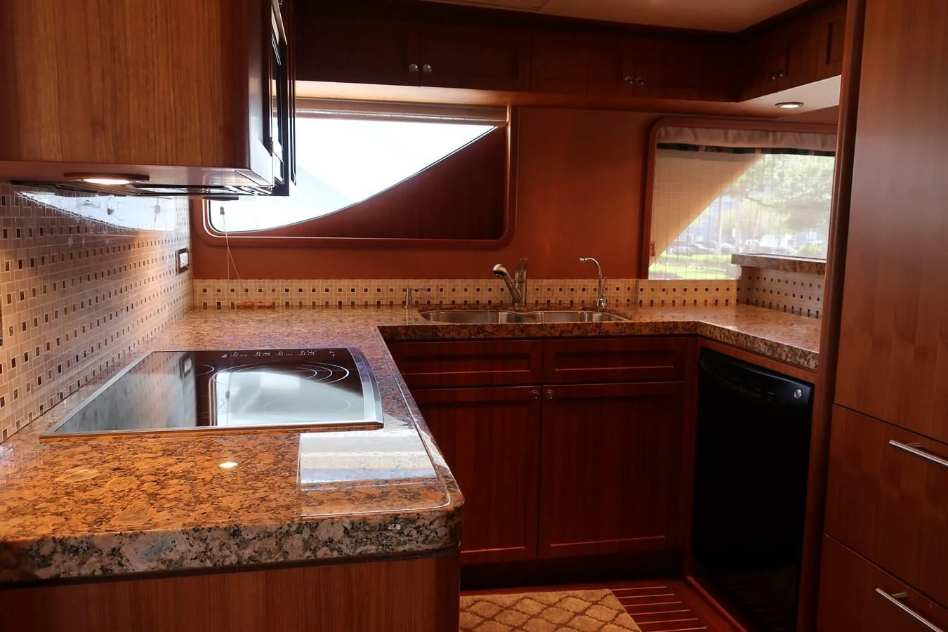a kitchen with a sink and cabinets aboard ST. TROPEZ Yacht for Sale
