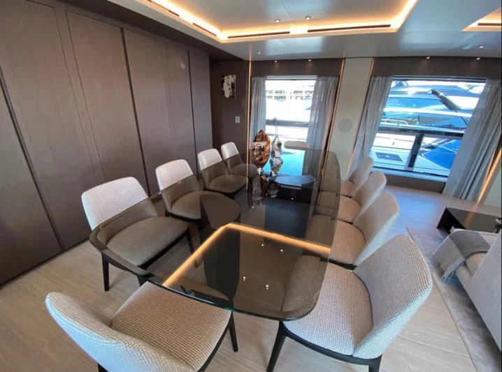 a room with chairs and a table aboard SELIN Yacht for Sale