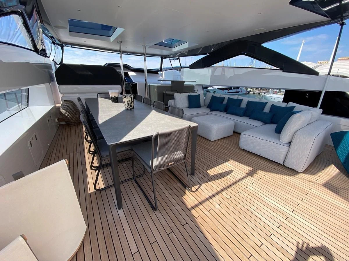 a room with a table and chairs aboard SELIN Yacht for Sale
