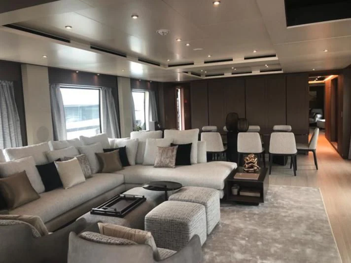 a living room with a couch and a table aboard SELIN Yacht for Sale