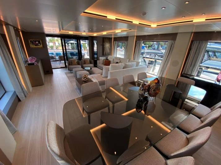 a room with a large table and chairs aboard SELIN Yacht for Sale