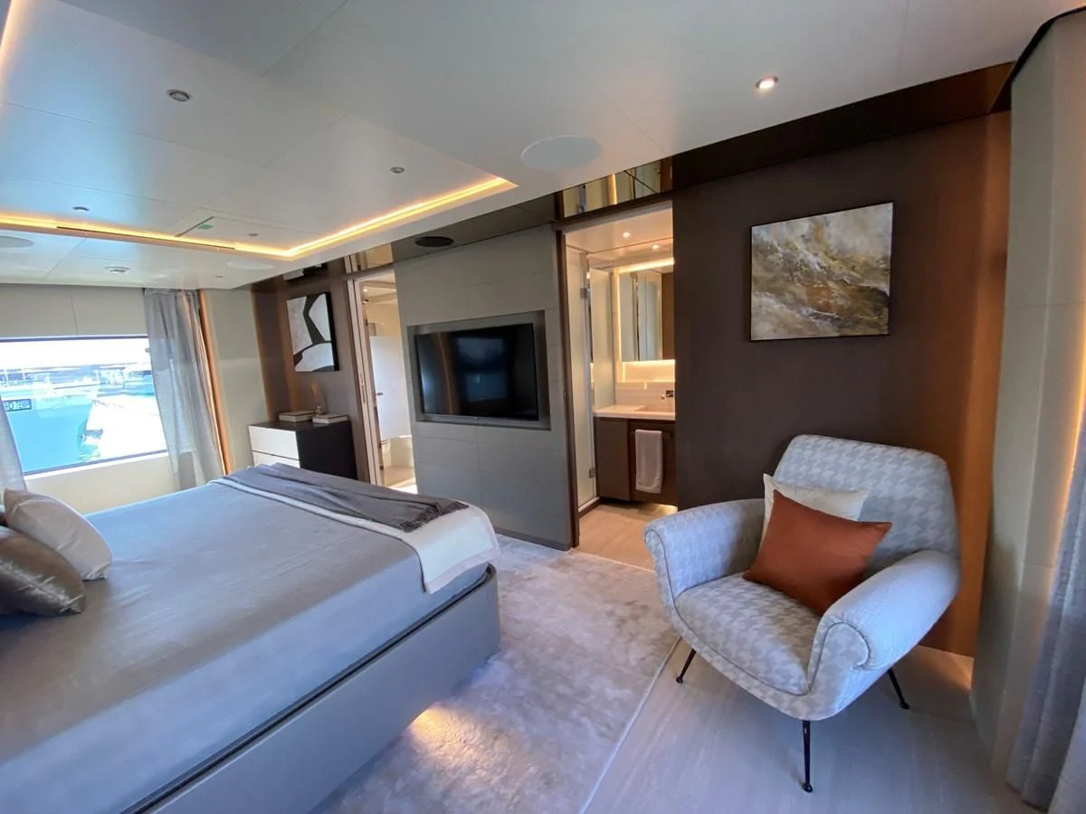 a bedroom with a bed and a tv aboard SELIN Yacht for Sale