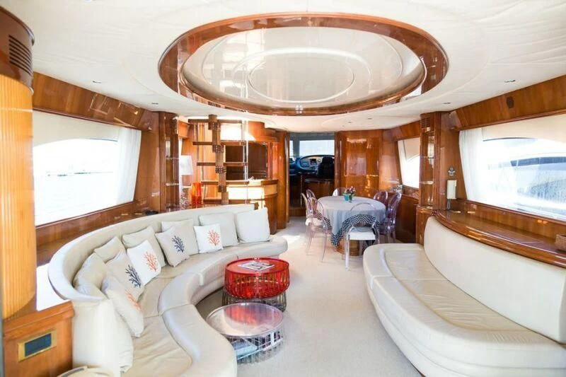 a living room with a large chandelier aboard NISAN Yacht for Sale