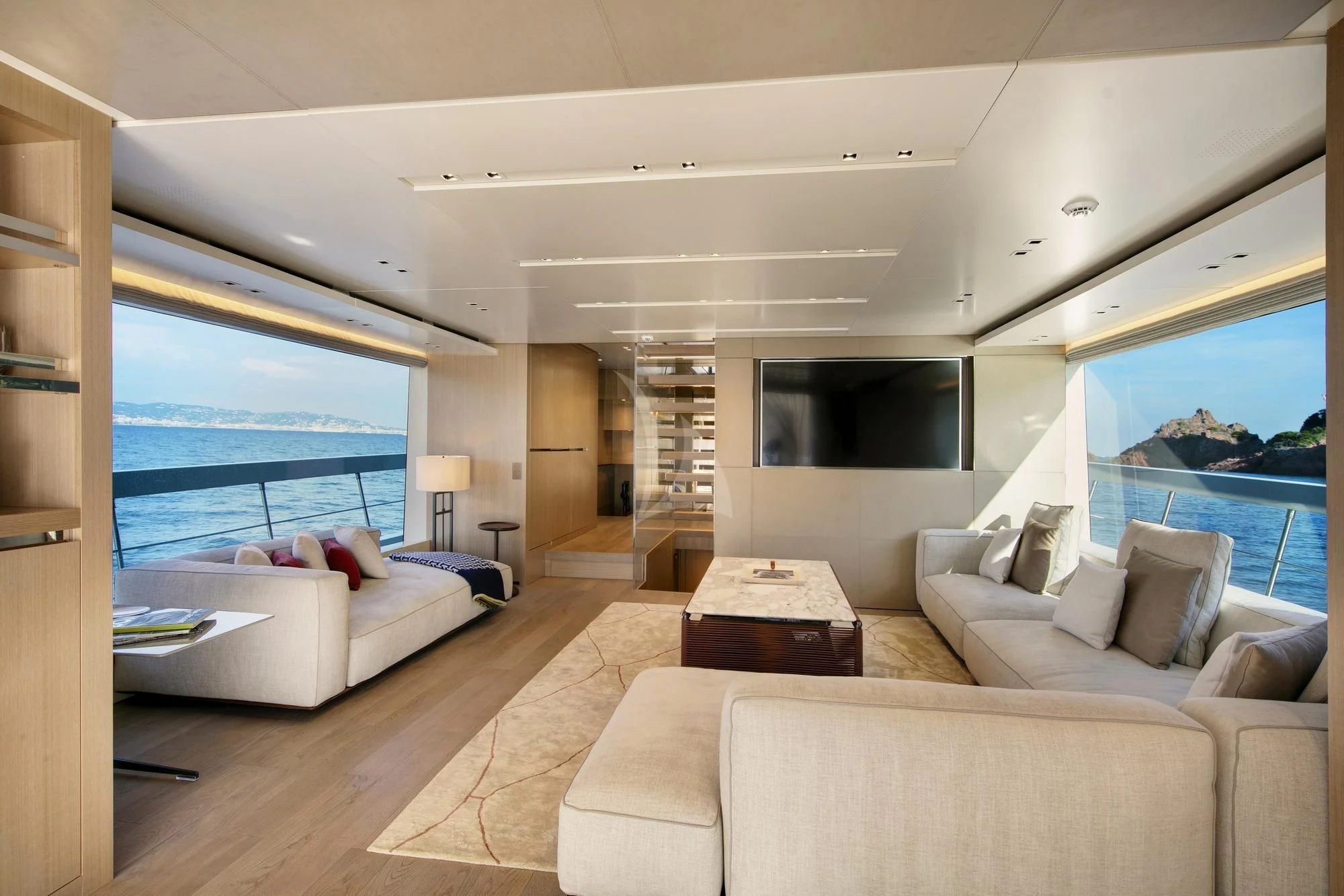 a living room with a large window aboard BELLE DE NUIT Yacht for Sale