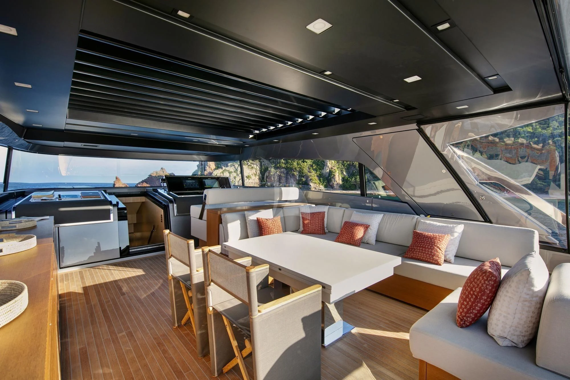 a room with a couch and a table and chairs aboard BELLE DE NUIT Yacht for Sale