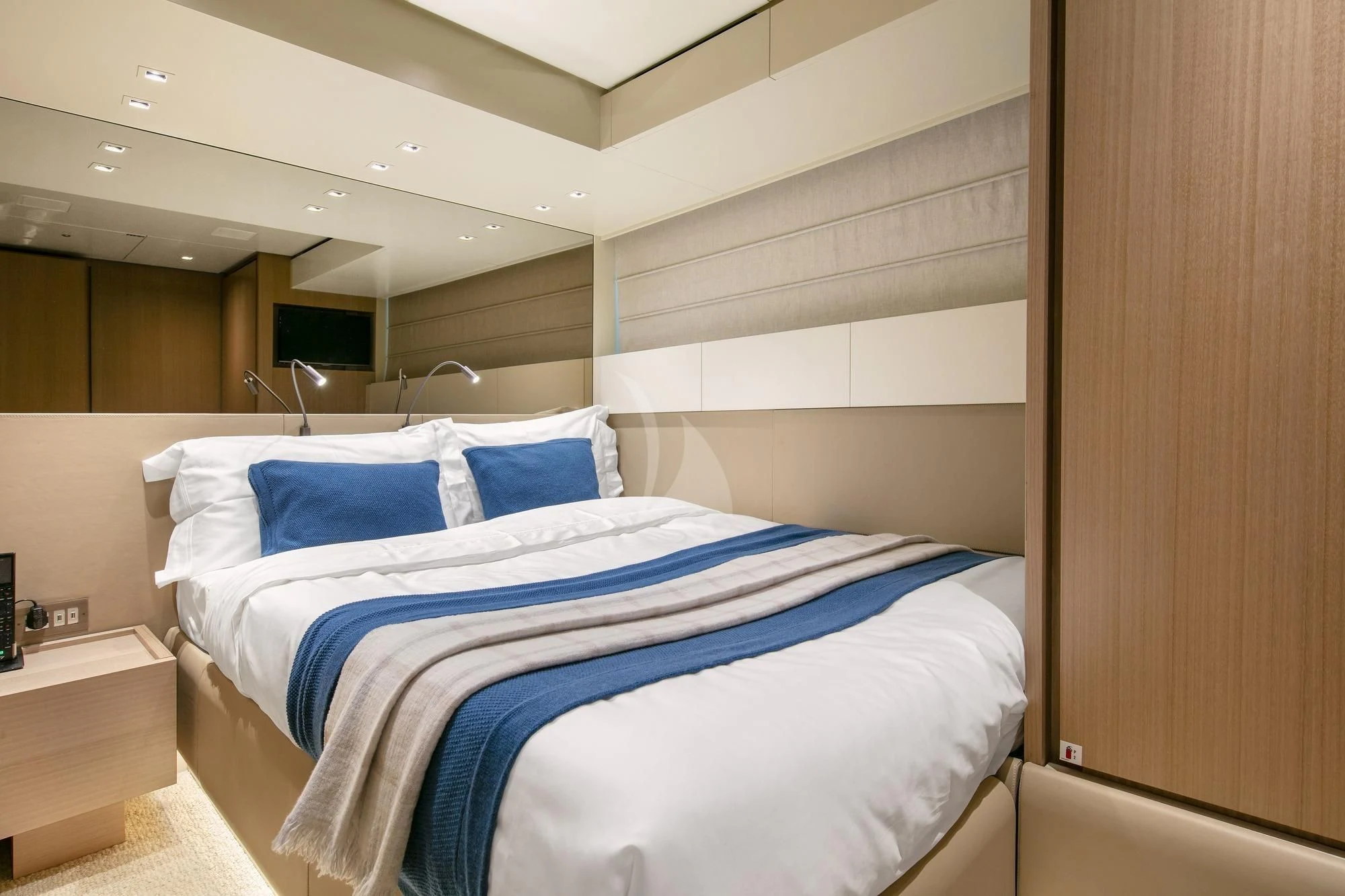 a room with a bed and a wood door aboard BELLE DE NUIT Yacht for Sale