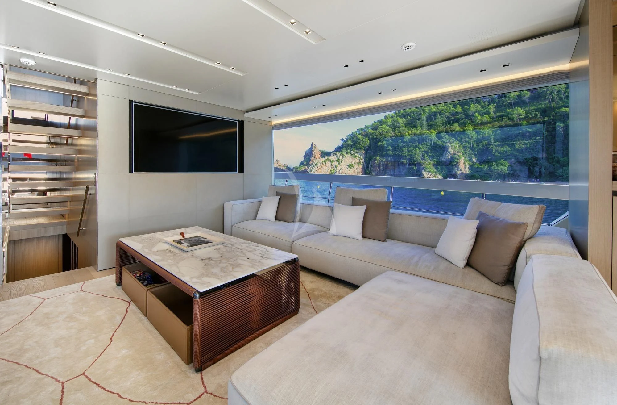 a living room with a couch and a table aboard BELLE DE NUIT Yacht for Sale
