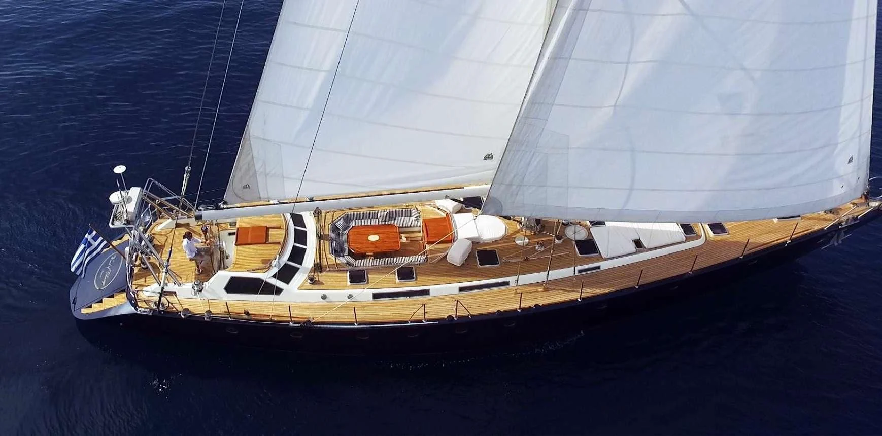 a large white boat in the water aboard WIND OF CHANGE Yacht for Charter