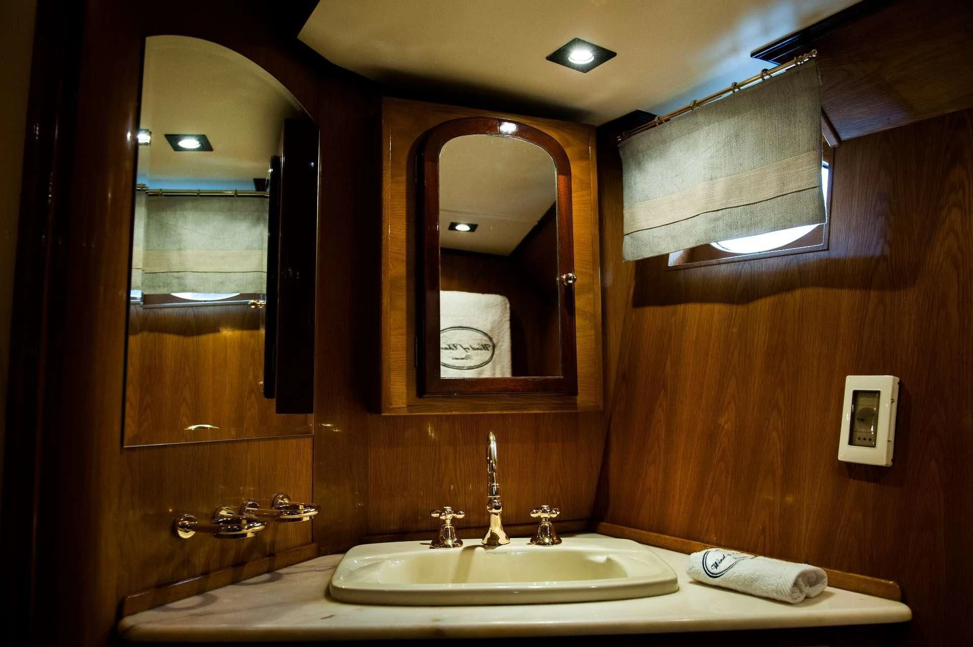 a bathroom with a large mirror aboard WIND OF CHANGE Yacht for Charter