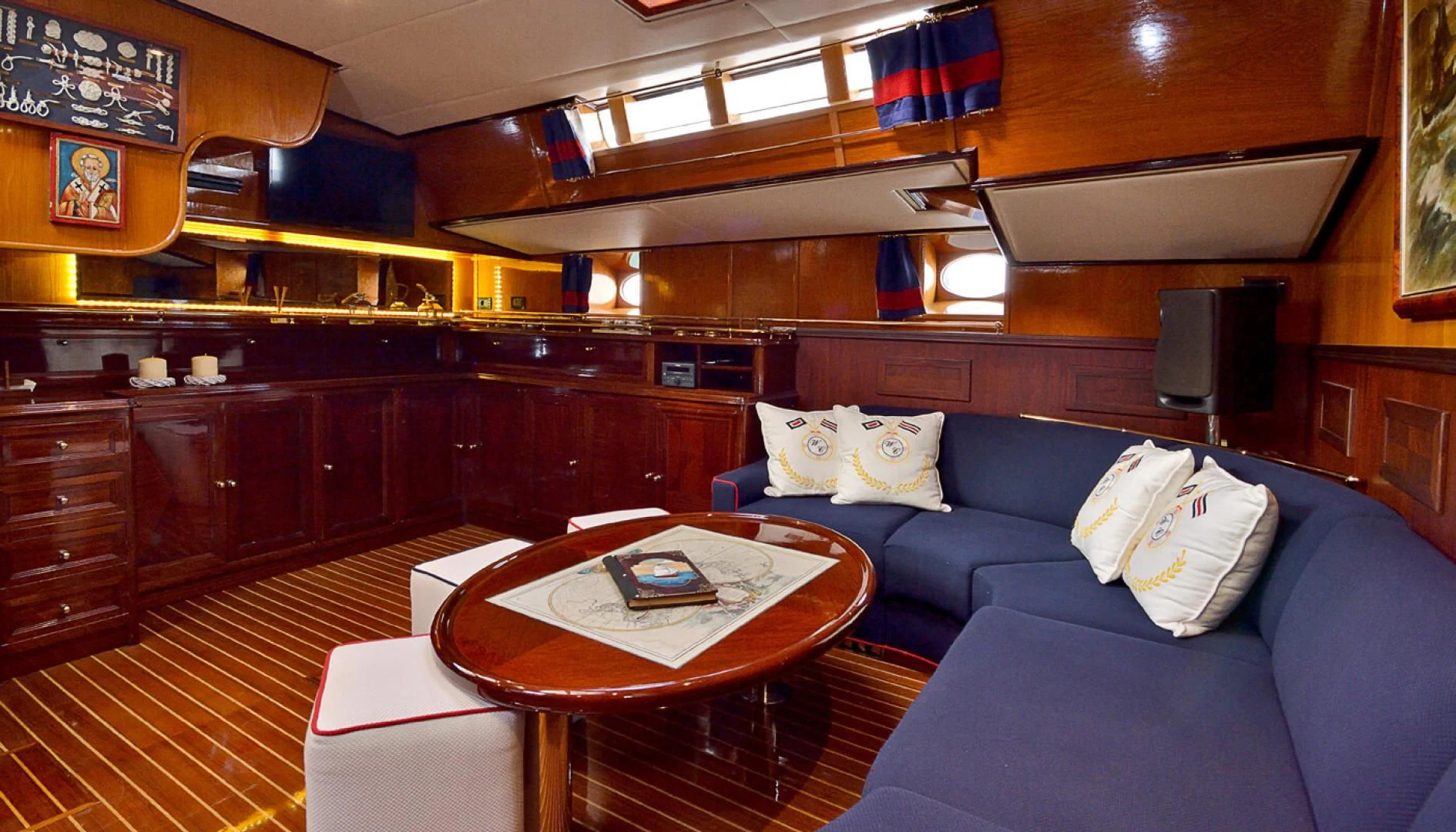 a living room with a couch and a coffee table aboard WIND OF CHANGE Yacht for Charter
