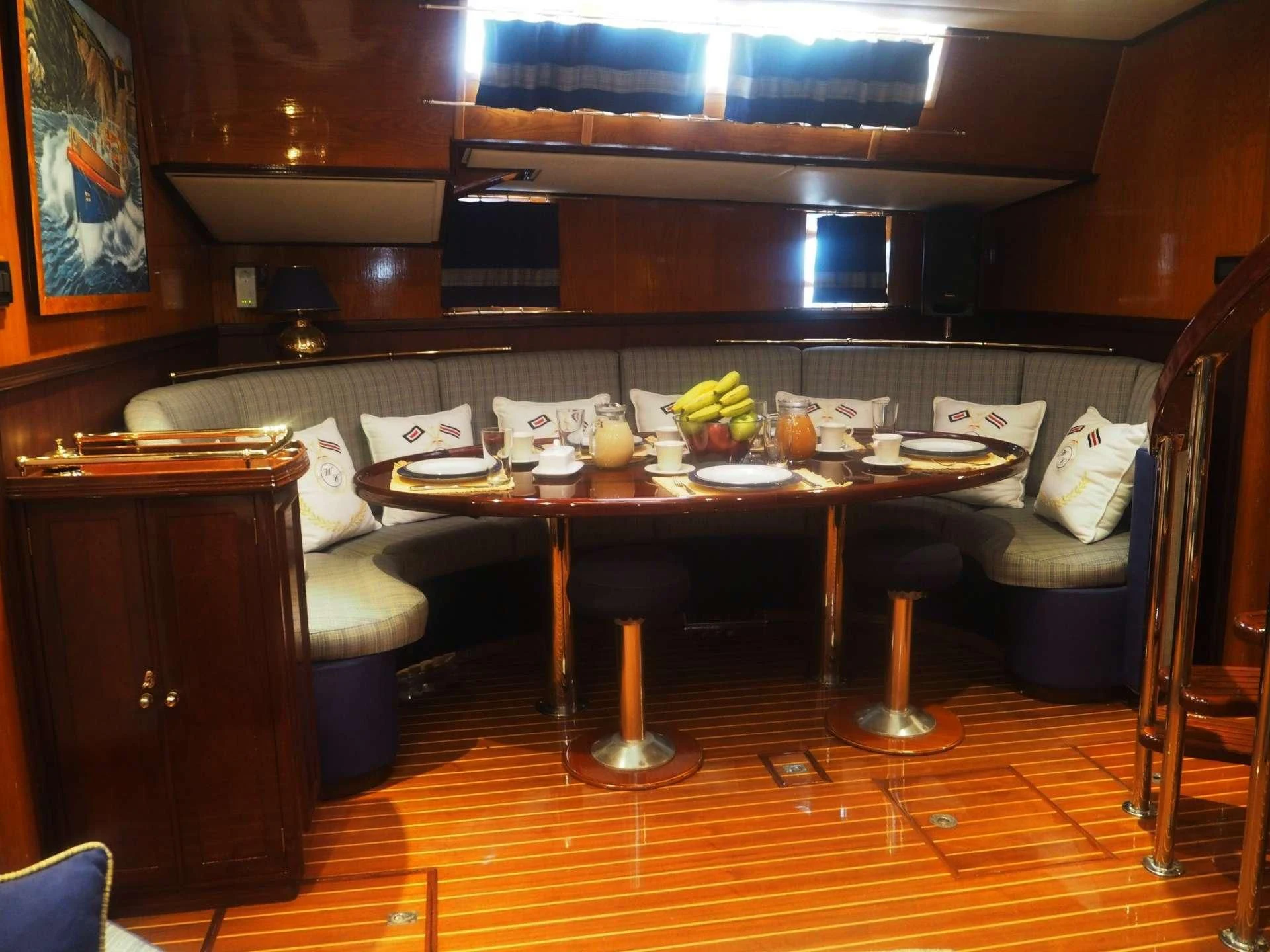 a room with a couch and a table aboard WIND OF CHANGE Yacht for Charter