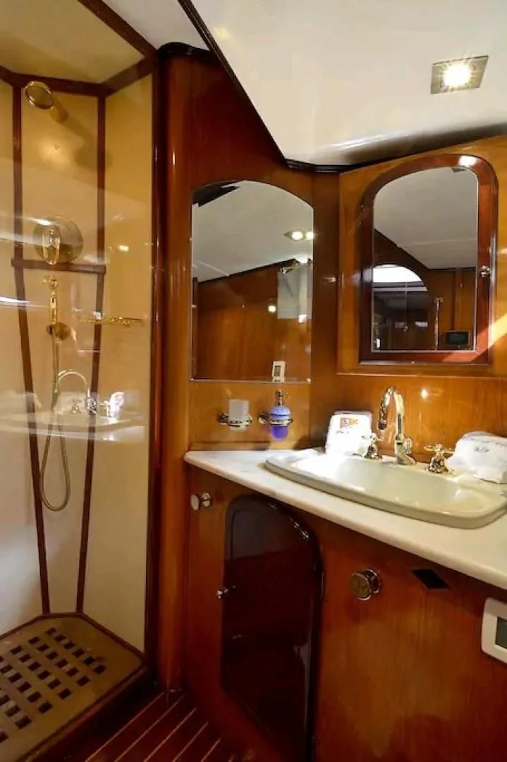a bathroom with a shower and sink aboard WIND OF CHANGE Yacht for Charter