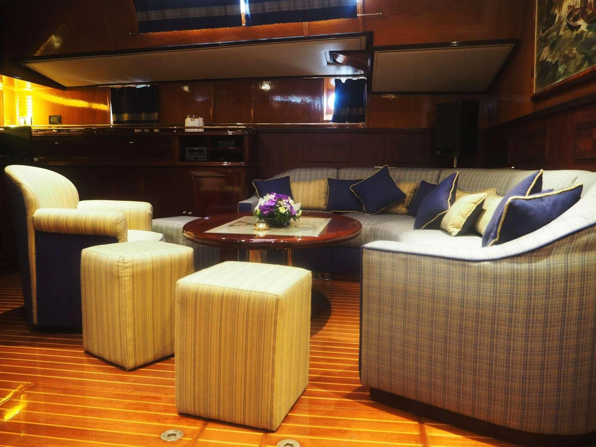 a living room with a couch and a coffee table aboard WIND OF CHANGE Yacht for Charter