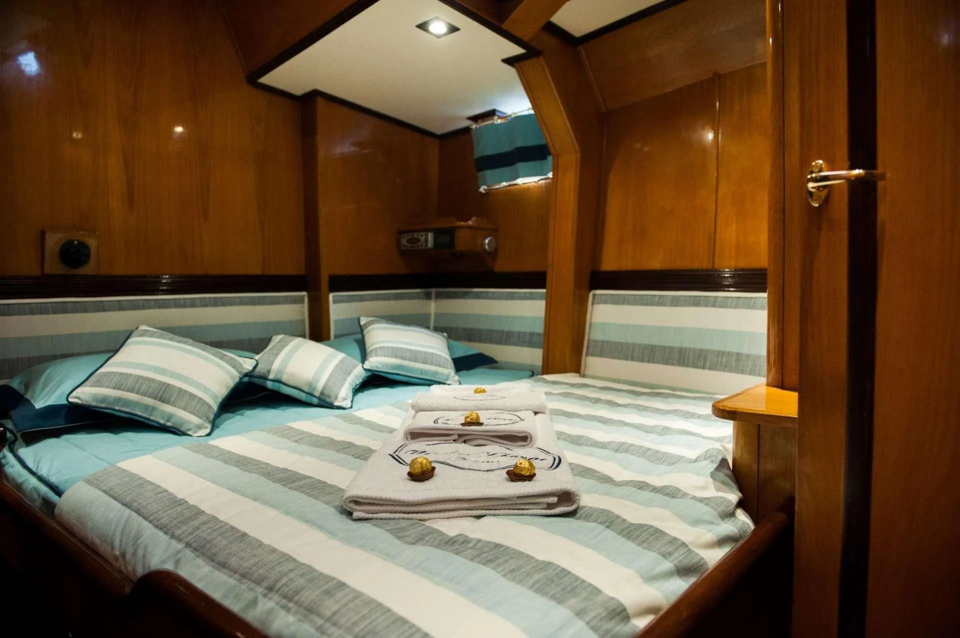 a bed with a tray of food aboard WIND OF CHANGE Yacht for Charter