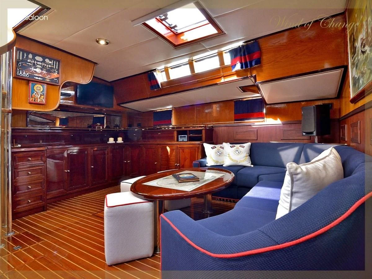 a living room with a couch and a coffee table aboard WIND OF CHANGE Yacht for Charter