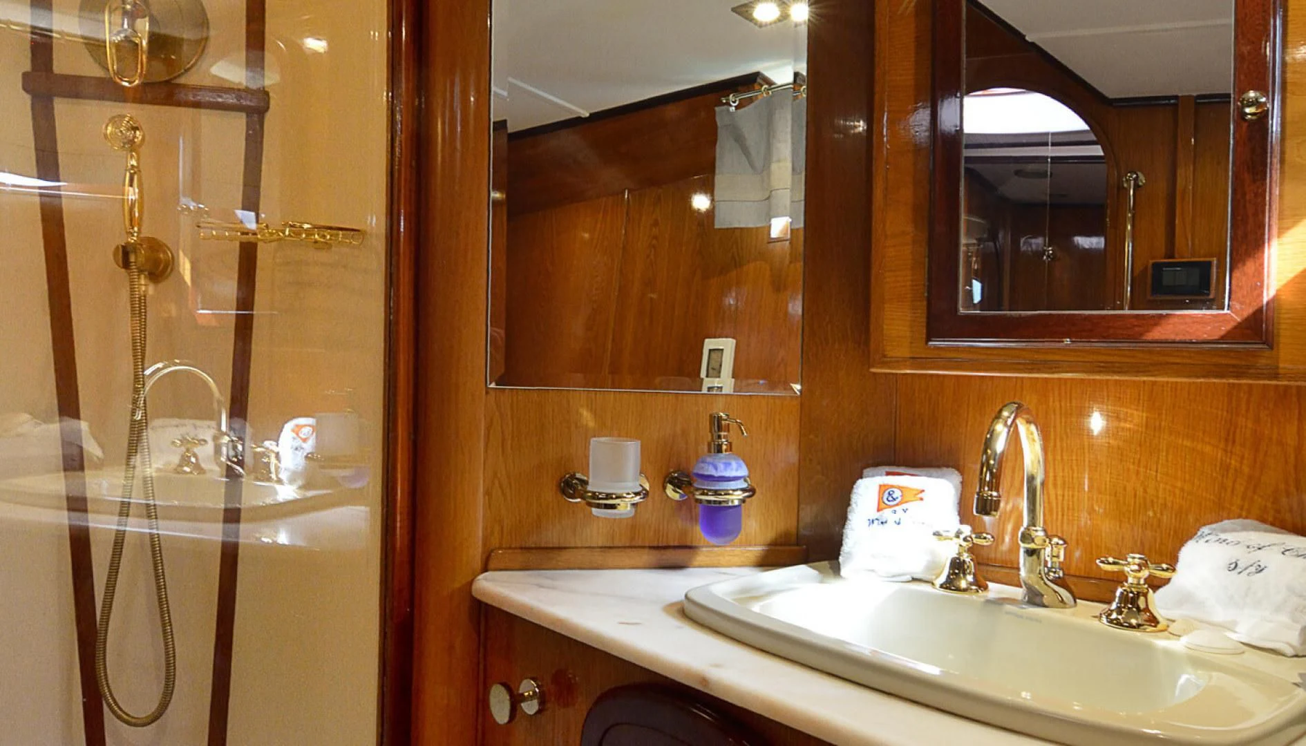 a bathroom with a sink and a mirror aboard WIND OF CHANGE Yacht for Charter