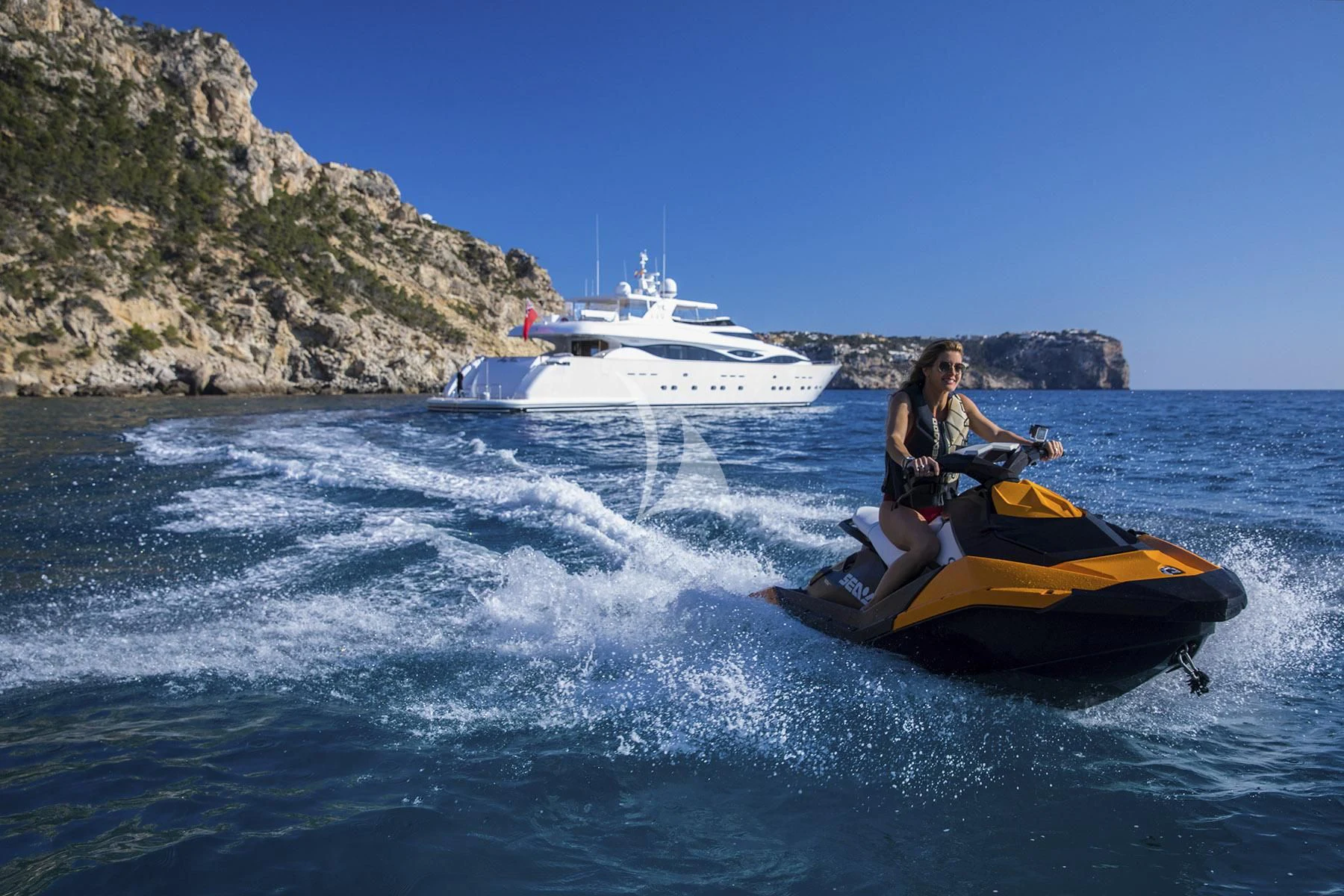 a couple people on a jet ski aboard ALWAYS BELIEVE Yacht for Sale