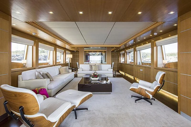 a living room with couches and a coffee table aboard ALWAYS BELIEVE Yacht for Sale