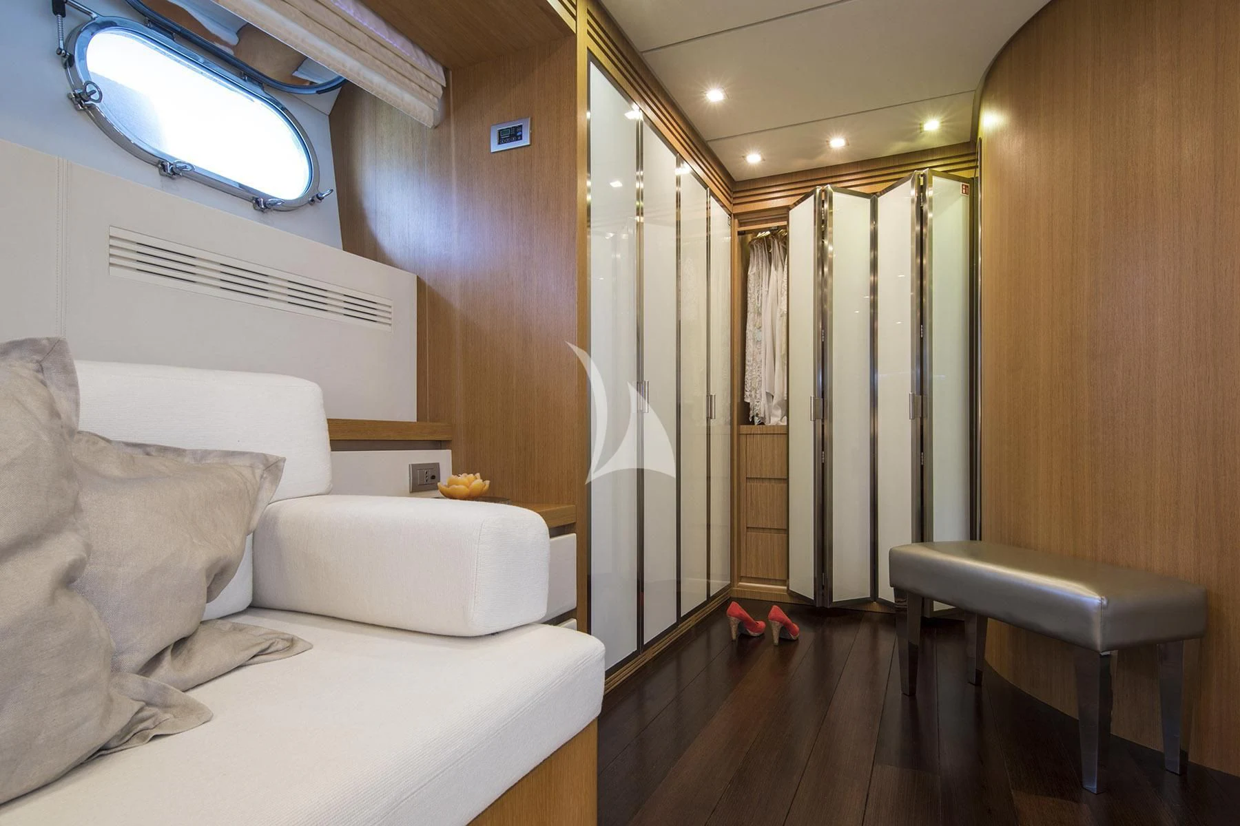 a room with a couch and a window aboard ALWAYS BELIEVE Yacht for Sale