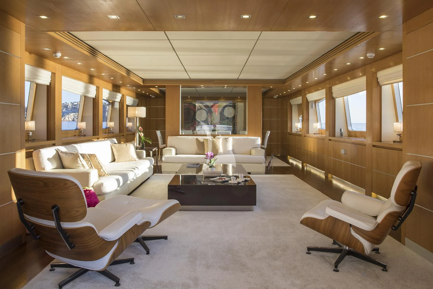a living room with white couches aboard ALWAYS BELIEVE Yacht for Sale