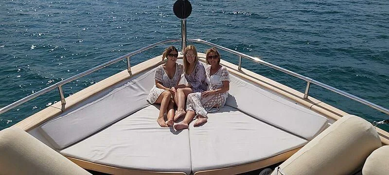 a group of people sitting on a boat in the water aboard ALWAYS BELIEVE Yacht for Sale