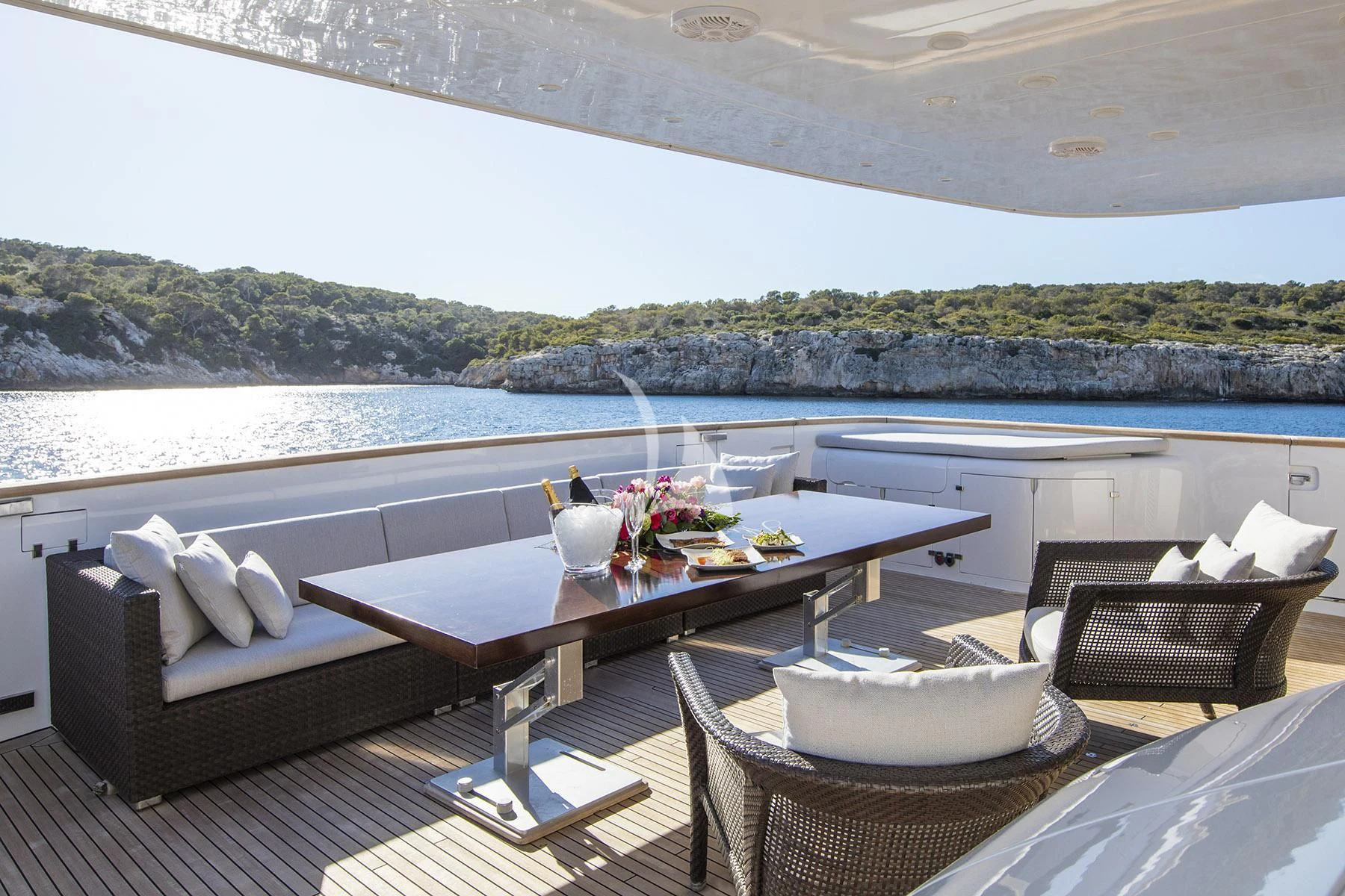 a patio with a table and chairs aboard ALWAYS BELIEVE Yacht for Sale